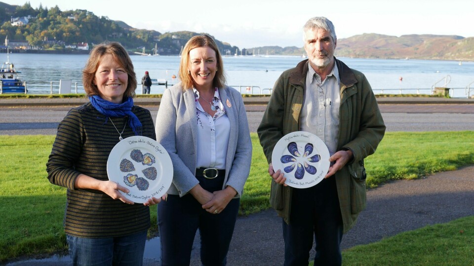 Judith Vajk of Caledonian Oysters, left, and Douglas Wilson of Inverlussa, were among the three winners of last year's contest to find the best oysters and mussels. They are pictured with Elaine Jamieson of HIE, which sponsors the competition. Photo: FFE.