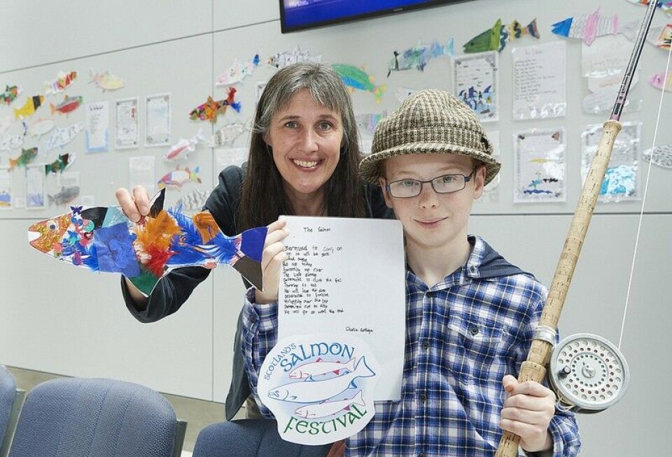Charlie Cartlidge, a pupil from Balloch Primary School, with Dr Melanie Smith, chair of Scotland's Salmon Festival steering group and Head of Research Development at Inverness College UHI. Charlie won a competition to write a poem about salmon to promote the fesitval. Photo: UHI Inverness College