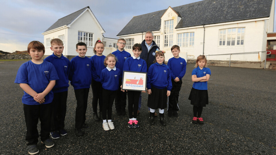 Stuart Witts, SSC area manager for East Loch Roag in the Isle of Lewis with Ava Douglas and classmates before the schools were closed. Photo: SSC.