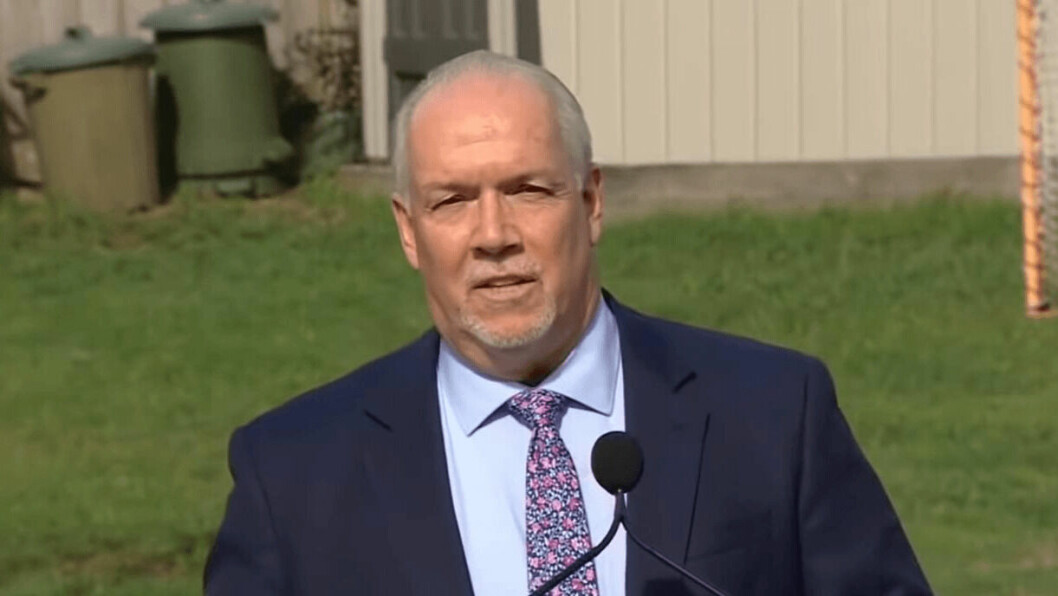 BC premier John Horgan pictured during a visit to a First Nations settlement. A decision not to renew salmon farm licences would cost hundreds of jobs and 