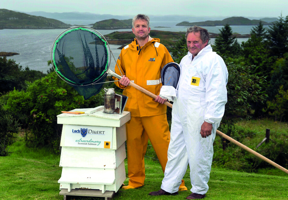 From left: Loch Duart’s production controller, Wayne Davis, and beekeeper Paul Whitehouse with one of the hives. Photo: Loch Duart