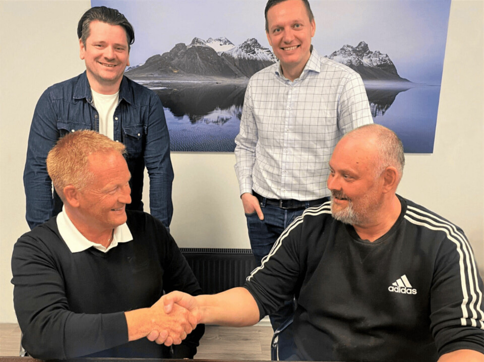 Geir Olav Melingen, front left, commercial director from Benchmark Genetics, and Haraldur Snorrason, head of the smolt operation at Landeldi, shake hands after signing a three-year extension of an ova supply contract. Also pictured are Landeldi chief financial officer Páll Ágústsson, back left, and Róbert Rúnarsson, global sales manager of Benchmark Genetics.