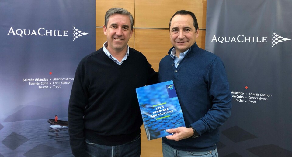 AquaChile boss Sady Delgado, left, and BioMar's Eduardo Hagedorn at the handover of AquaChile's share of the feed plant. Photo: BioMar.