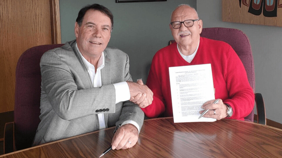 Jim Parsons, who was then general manager of Cooke Aquaculture Pacific, and W Ron Allen, Tribal Council chair/CEO of the Jamestown S’Klallam Tribe, signing the partnership agreement in 2019.