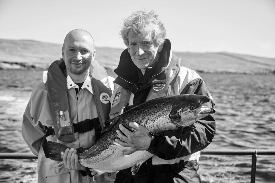 It's all there in black and white: YO! executive chef Mike Lewis, left, and chief executive Robin Rowland get to grips with a farmed salmon. Photo: YO!