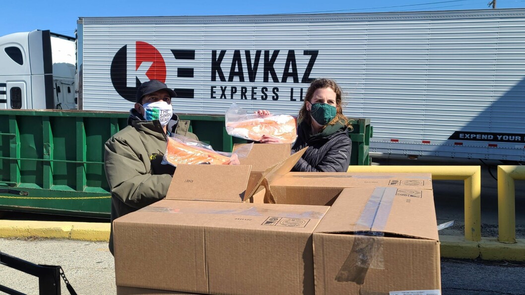 Volunteers with some of the salmon donated by AquaBounty to hunger relief group Philabundance. Photo: Philabundance / Twitter. Volunteers with some of the salmon donated by AquaBounty to hunger relief group Philabundance. Photo: Philabundance / Twitter.