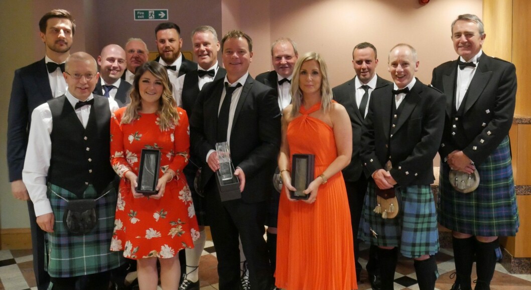 Marine Harvest MD Ben Hadfield, centre, with members of staff after a victorious night in Aviemore. Photo: FFE Marine Harvest MD Ben Hadfield, centre, with members of staff after a victorious night in Aviemore. Photo: FFE