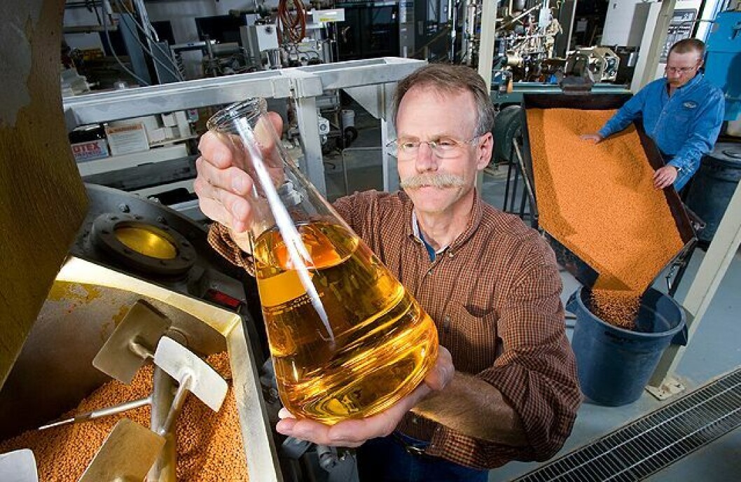 Fish nutritionist Rick Barrows examines flax oil that will be infused into pellets for rainbow trout feed. Photo: Steve Ausmus USDA/ARS Fish nutritionist Rick Barrows examines flax oil that will be infused into pellets for rainbow trout feed. Photo: Steve Ausmus USDA/ARS