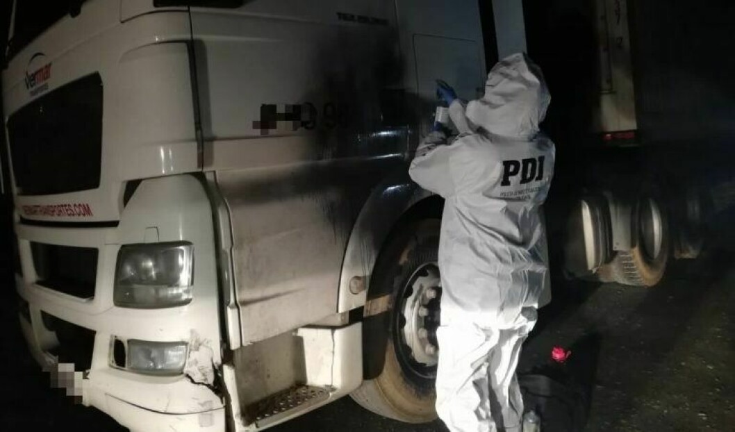 A forensics officer examines the stolen lorry. Photo: Chilean police.
