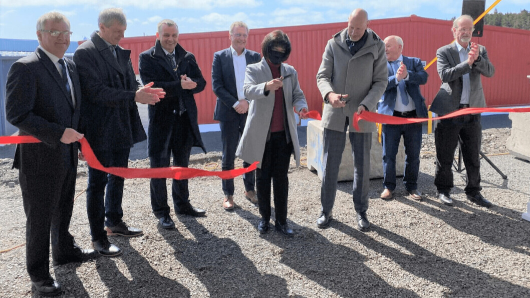 Ginette Petitpas Taylor, Canada’s minister responsible for the Atlantic Canada Opportunities Agency, and Jon Elvedal Fredriksen, Norwegian ambassador to Canada, jointly cut the ribbon to officially open Grieg Seafood Newfoundland's operations. They were watched by, among others, Greig chief executive Andreas Kvame (behind Petitpas Taylor) and AquaMaof boss David Hazut, right. Photo: GSN.
