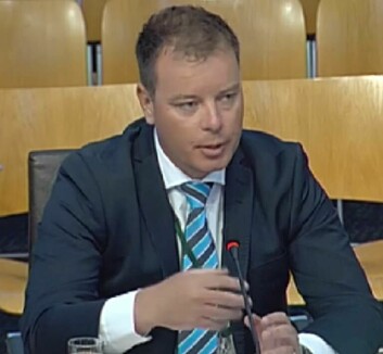 Ben Hadfield pictured giving evidence to the REC inquiry.