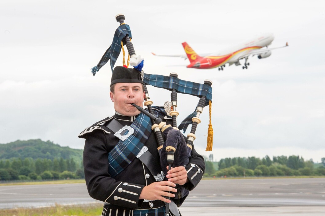 Tuesday's inaugural Hainan Airlines flight was accompanied by the sound of Scottish pipes. Today's - the first direct to Beijing - was accompanied by Scottish salmon. Photo: Ian Georgeson Tuesday's inaugural Hainan Airlines flight was accompanied by the sound of Scottish pipes. Today's - the first direct to Beijing - was accompanied by Scottish salmon. Photo: Ian Georgeson