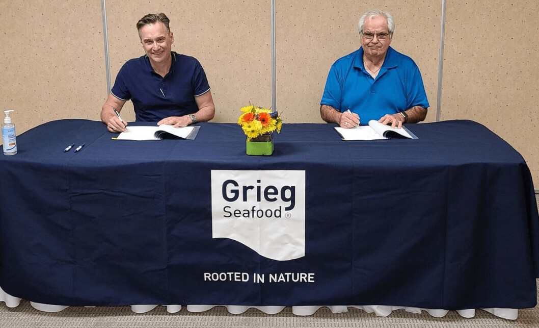 Grieg Seafood BC managing director, Rocky Boschman, left, and Councillor Thomas Smith sign the contract. Photo: Grieg Seafood. Grieg Seafood BC managing director, Rocky Boschman, left, and Councillor Thomas Smith sign the contract. Photo: Grieg Seafood.