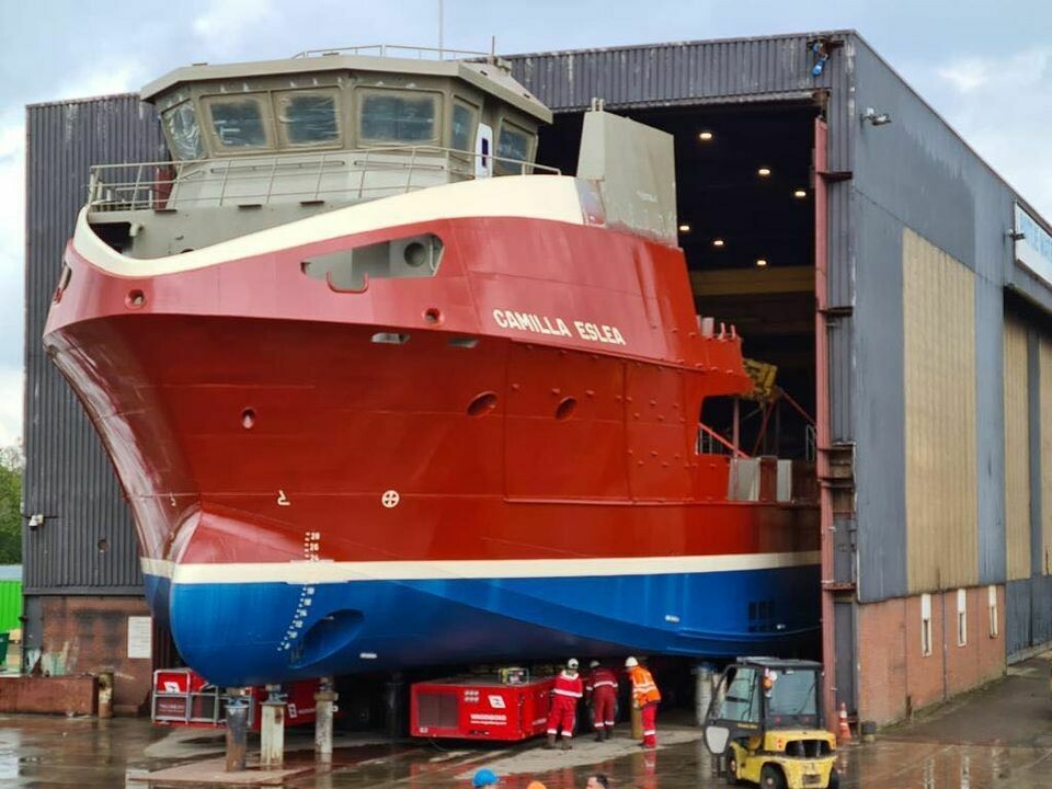The front half of the Camilla Eslea was moved out of the shed to fit the wheelhouse. Photo: Nauplius Workboats/Inverlussa.