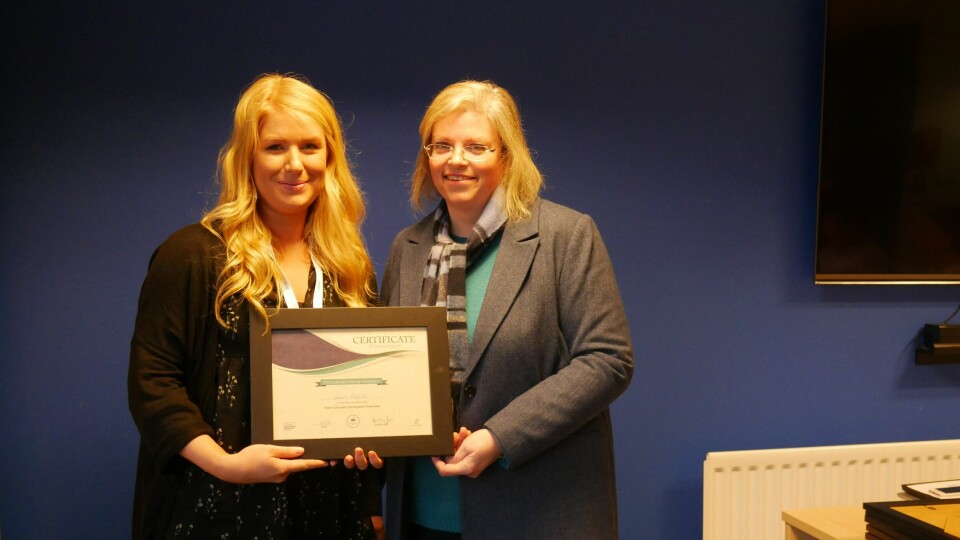 Mowi's new Uist and Barra area manager Connie Pattillo, left, pictured being presented with a certificate by the then Scottish Salmon Producers' Association sustainability director Anne Anderson after completing a junior executive development programme in 2019. Photo: FFE.