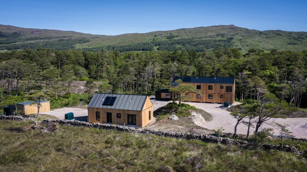 The manager's house, foreground, and accommodation block on Rum. The six bedrooms in the block are en-suite, split across two storeys, with each level having its own kitchen living and dining area. There is also an attached visitor’s annex. Photo: Mowi Scotland.