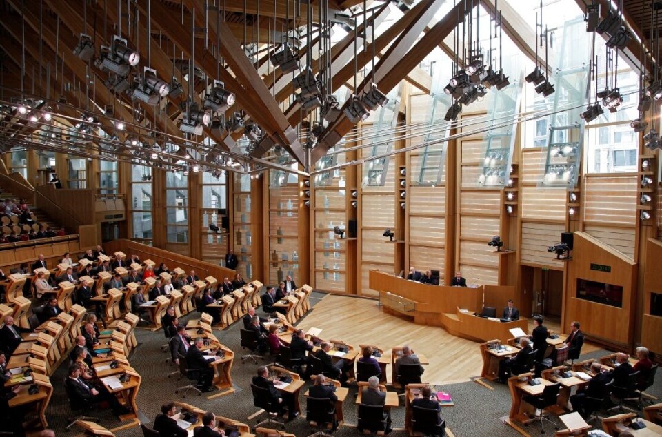 File photo of the Scottish Parliament in session. MSPs will today debate a committee report about salmon farming that has been criticised by fish farmers for missing an opportunity to support the sustainable development of the sector.