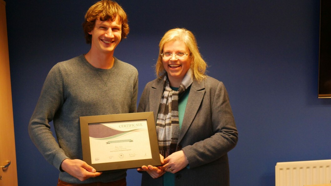 Ben Weiss, Mowi farm manager, is presented with his certificate by SSPO sustainability director Anne Anderson. Photo: FFE. Ben Weiss, Mowi farm manager, is presented with his certificate by SSPO sustainability director Anne Anderson. Photo: FFE.