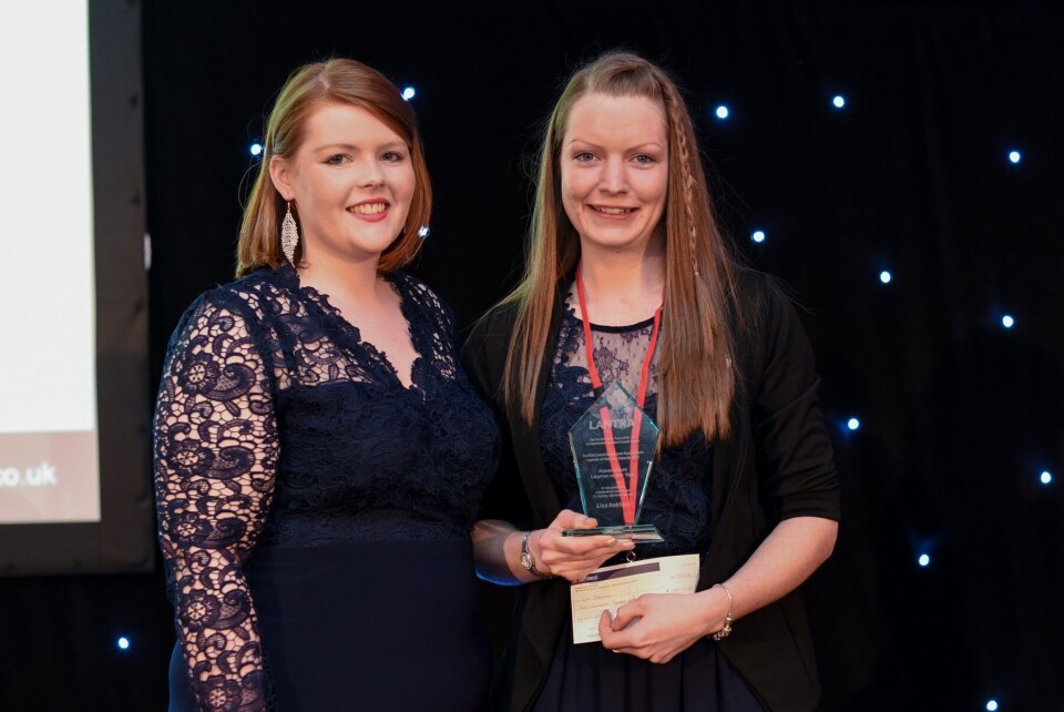 24-year old Lisa Askham (right) is presented with this year's Lantra Aquaculture Learner of the Year Award by former winner Finulla McCloskey (left)