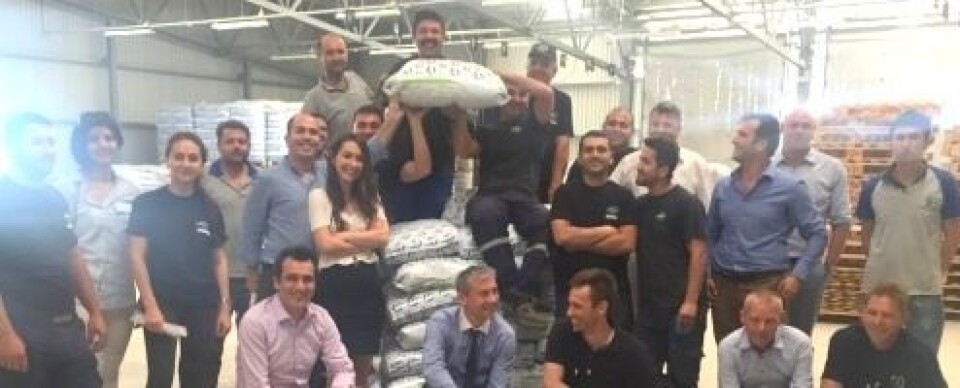 BioMar-Sagun employees and factory construction project members from BioMar in Denmark proudly present the first bag of feed produced at the BioMar-Sagun factory.
