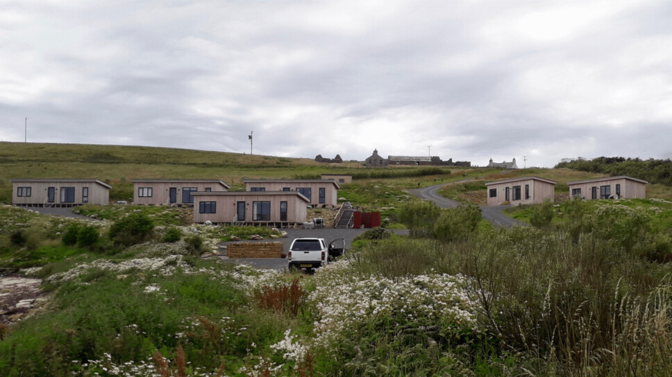 Lodges were built for salmon farm workers by Scottish Sea Farms on Eday, but these are not the same as the affordable permanent homes that Salmon Scotland says are needed for workers in all industries in the Highlands and islands.