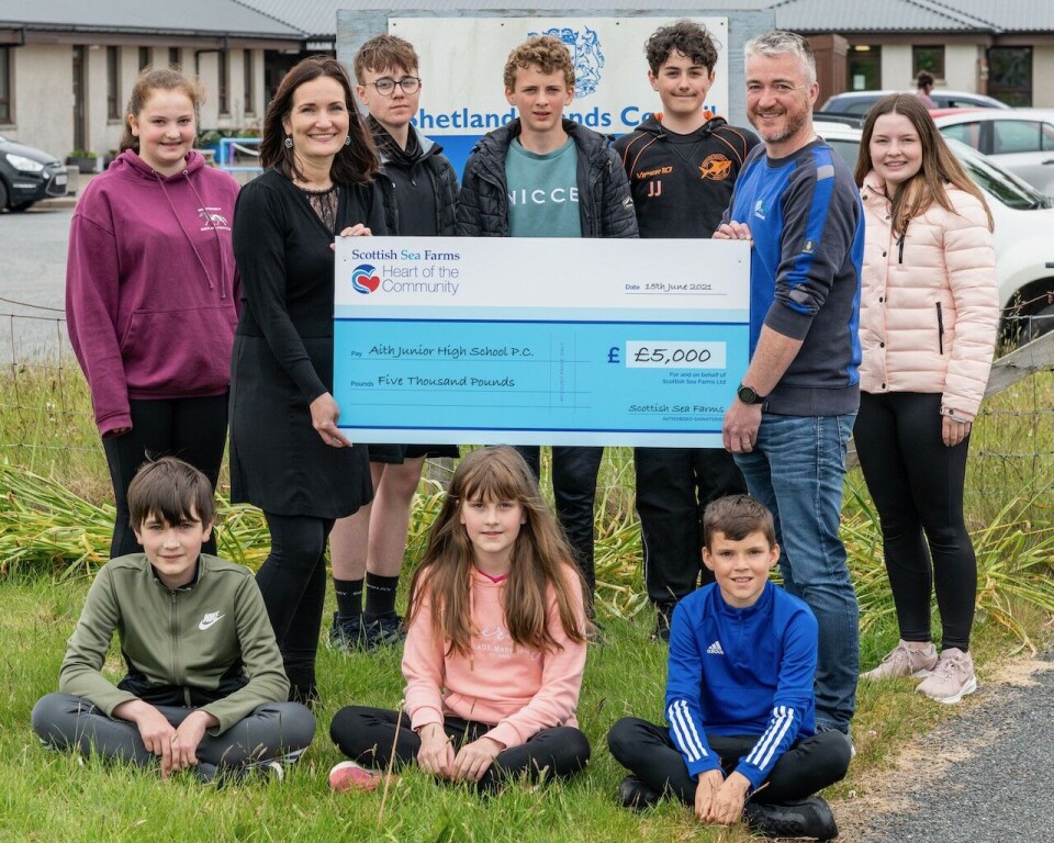 Principal teacher Ingrid Smith and Scottish Sea Farms area support manager Robbie Coutts with Aith Junior High School pupils. Photo: Gordon Siegel Photography