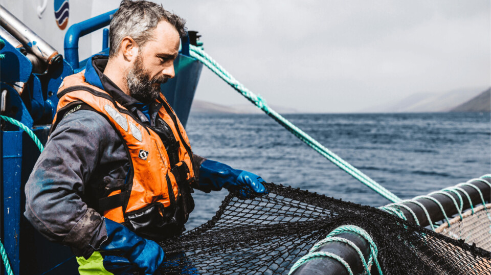 A file photo of a farm technician at work at a Scottish Sea Farms site in Shetland.