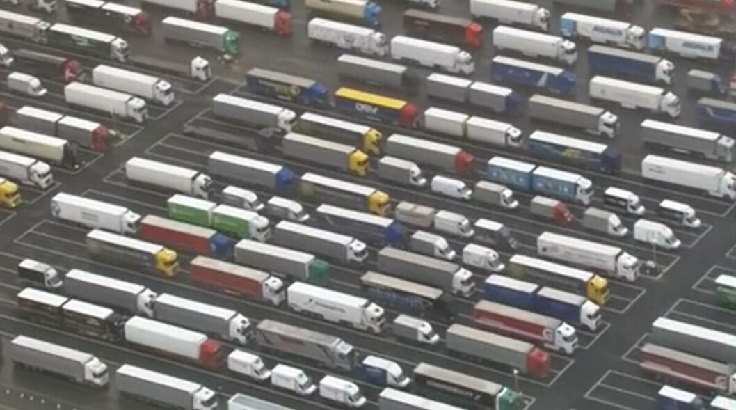 Just a fraction of the 3,000 or more lorries waiting at Manston Airport in Kent to cross to France. Photo: BBC. Just a fraction of the 3,000 or more lorries waiting at Manston Airport in Kent to cross to France. Photo: BBC.