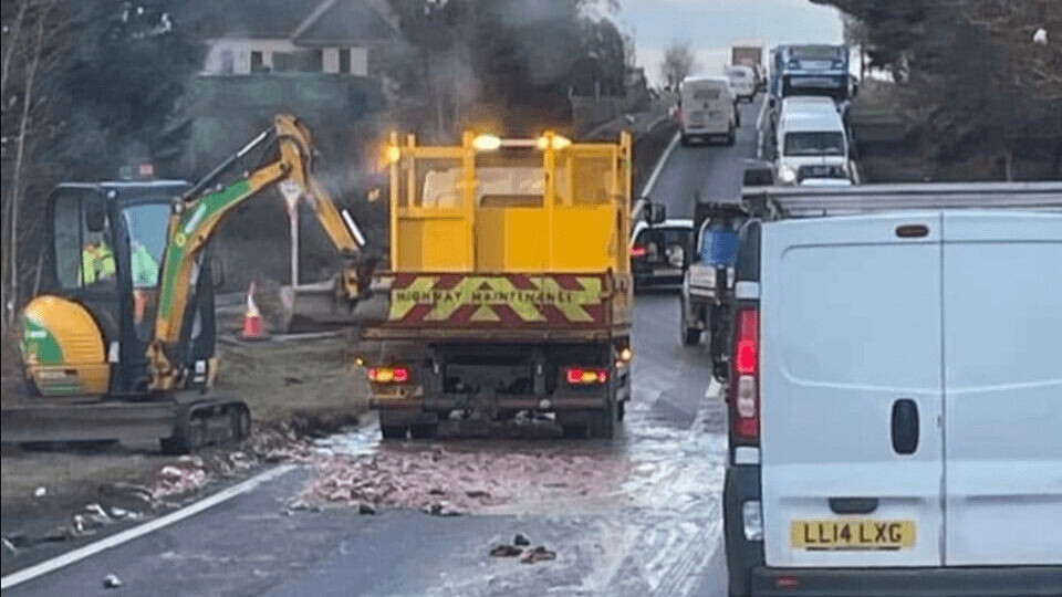 Traffic delays on the A96 near Elgin where salmon that had spilled from a lorry was being cleared by BEAR Scotland. Photo: MorayNews.