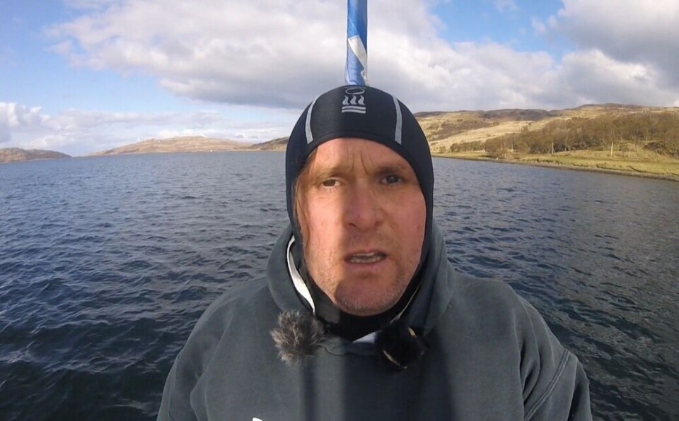 Don Staniford during a clandestine visit to a salmon farm. The activist uses a Go-Pro camera mounted on a long pole to film moribund fish which he features in anti-farming videos.