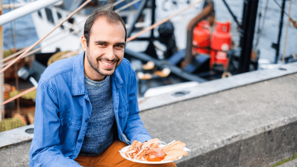 Rise-Up project researcher George Charalambides, from SAMS, at the Railway Pier in Oban, one of many towns that benefits from a thriving seafood sector. Photo: SAMS.