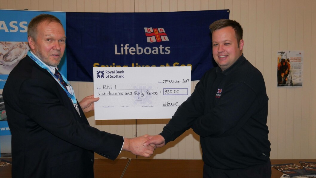 Nick Lake, chief executive of the ASSG, presents RNLI lifeboat mechanic Tom Kennedy with a cheque for £930. Photo: Gareth Moore/FFE Nick Lake, chief executive of the ASSG, presents RNLI lifeboat mechanic Tom Kennedy with a cheque for £930. Photo: Gareth Moore/FFE