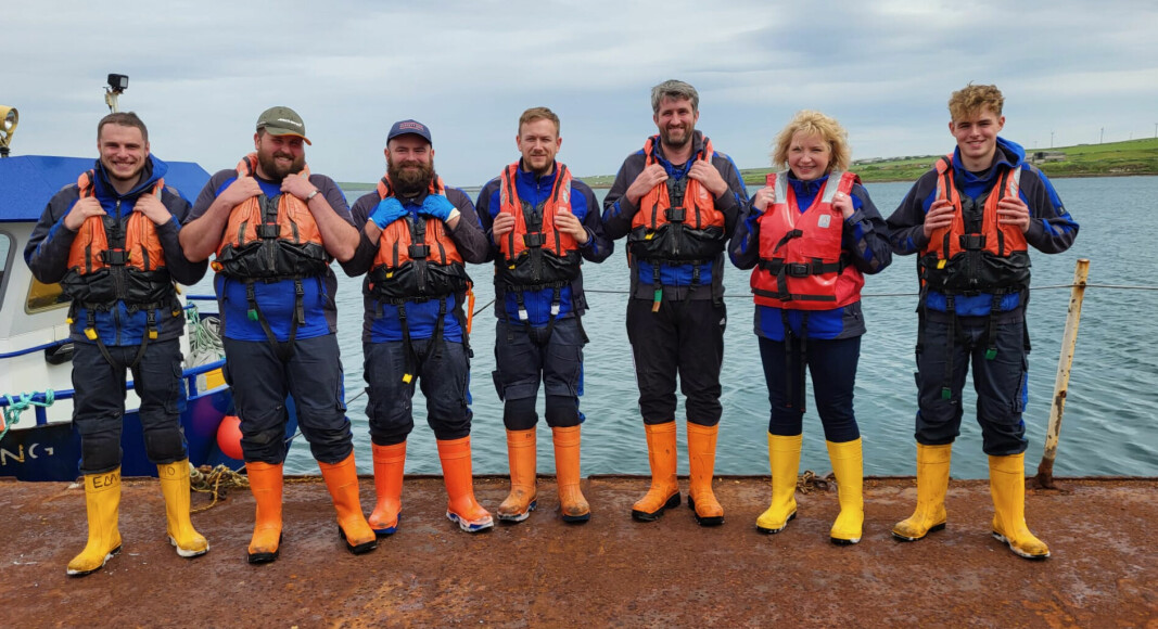 Anna Price, SSF’s aquaculture technical lead for ASC, with the Lober Rock team. From left: Lee Mainland, Jack Hutton, Greig Fogarty, Andrew Park, Andrew Coghill, Anna Price and Harvey Wooldrage.