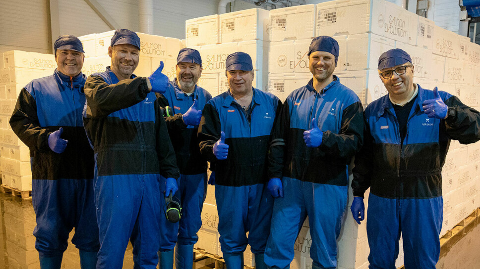 Salmon Evolution staff celebrate a milestone moment for the company, which has harvested its first fish.