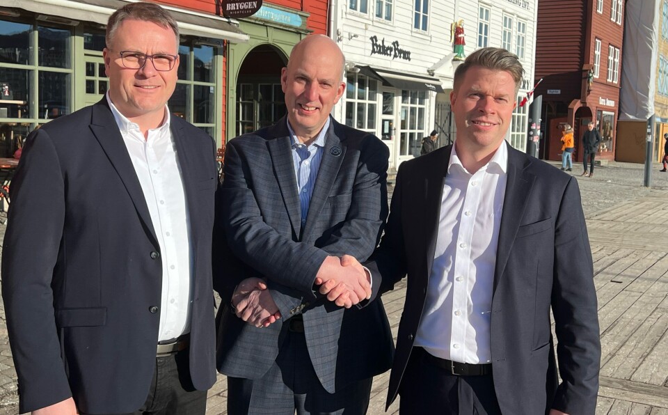 From left: Rune Risnes (aquaculture lead in Salt Ship Design AS), John Marshall (head of Benchmark Animal Health) and Frank Edvard Vike (chief sales officer at MMC First Process) shake on the deal in Bergen, Norway.