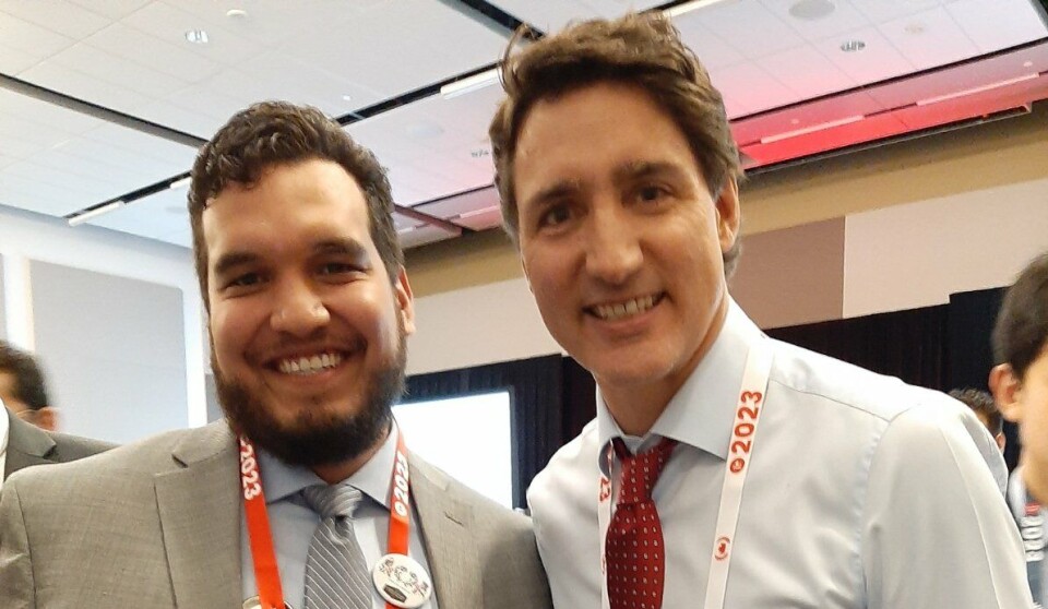 Isaiah Robinson pictured with Justin Trudeau last year. Robinson has added his voice to calls for six-year licence renewals for salmon farms in British Columbia.