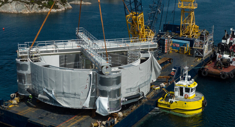 The OptiRAS being transported from the Lervik yard to Bremnes Seashore's site on a crane barge.