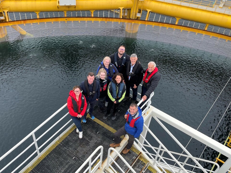 A visit by Scottish rural affairs minister Mairi Gougeon (centre, with yellow sleeves) to Ocean Farm 1 in 2023. Frode Arntsen is in the centre of the back row, next to SalMar majority owner Gustav Witzøe (red life preserver). The visitors included executives from Scottish Sea Farms, owned 50-50 by SalMar and Lerøy Seafoods Group, and Scottish Government officials.