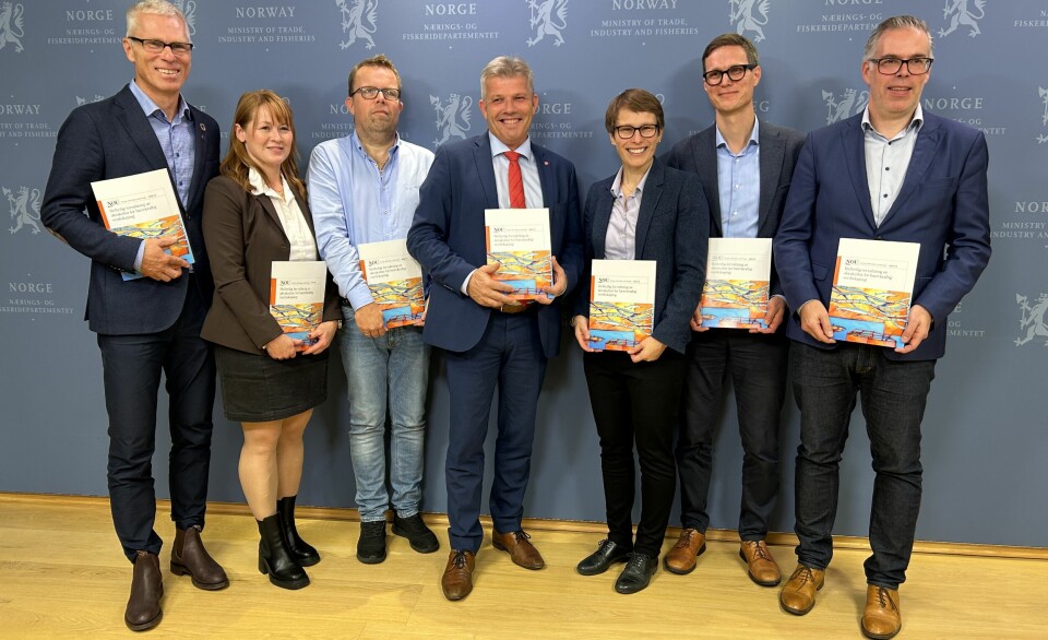 Norway's fisheries and aquaculture minister Bjørnar Skjæran, fourth from left, with members of the committee that produced the report.
