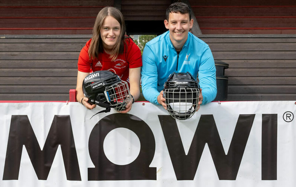 Young shinty players with the Mowi-branded subsidised helmets.