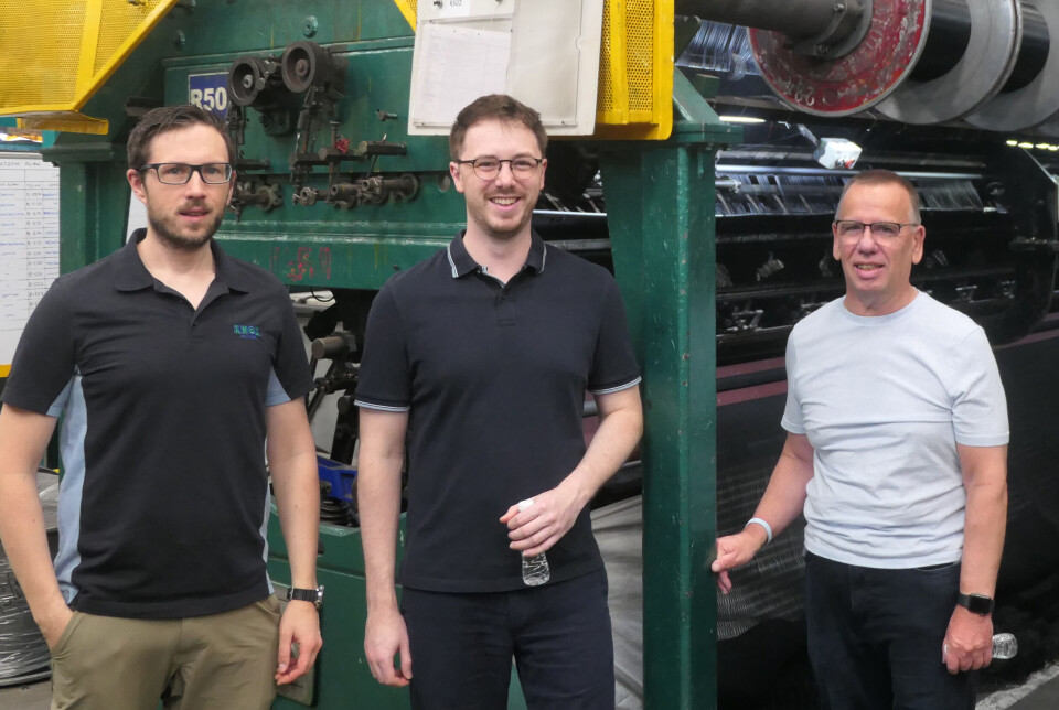 From left: W&J Knox general manager Rhuaraidh Edwards, technical manager Ryan Ganfield, and managing director Finlay Oman in front of the first knotless netting loom used by Indian supplier Garware. It was originally Knox’s machine.