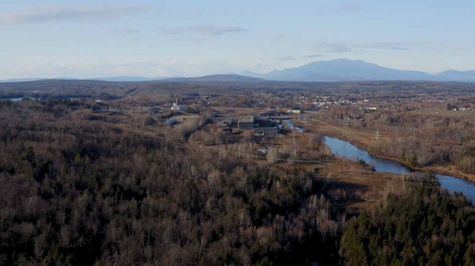 Millinocket with the remaining parts of the paper mill in the foreground and Mount Katahdin behind. Great Northern Salmon's facility will be located to the right of the river. The paper mill only occupied a small portion of the 1,400-acre site.