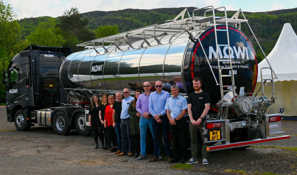 From left: Becky MacGillivray (Mowi), Carly Ferguson (FTS), Carol MacKinnon (FTS), Angus MacKay (Mowi), Michael Oliver (FTS), Sarah Donaldson (Mowi), Kris Wilk (Mowi), Scott Nolan (Mowi), Colin MacKinnon (FTS), and Henry Bateman (Mowi), in front of a new Mowi-liveried salmon tanker on display at the Aquaculture UK trade show in Aviemore in May.