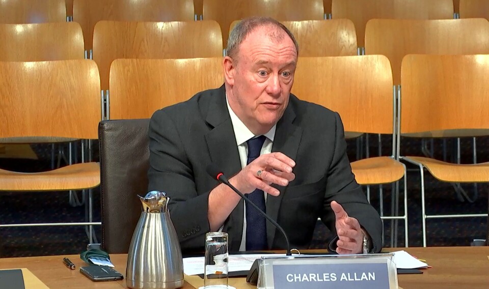 Charles Allan answers a question during a marathon evidence session at the Scottish Parliament.