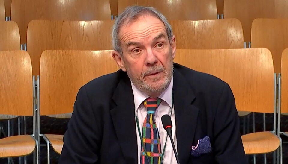 SAMS director Nick Owens, pictured giving evidence to the Scottish Parliament's inquiry into progress in the salmon farming sector, is among scientists advising the government to choose a different way to permit offshore farms.