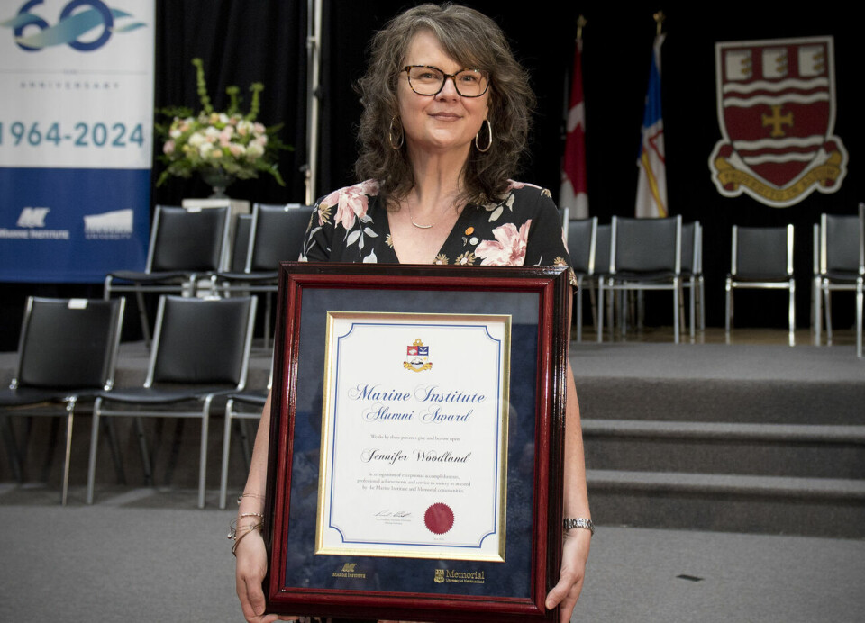 Grieg Seafood BC MD Jennifer Woodland with her award from Memorial University. Woodland has been described as a champion for aquaculture.