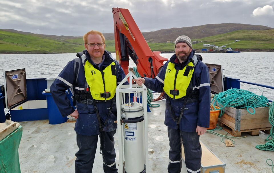 SAMS PhD student Gary Groves, left, and Gregg Arthur of UHI Shetland prepare the IFCB for deployment.