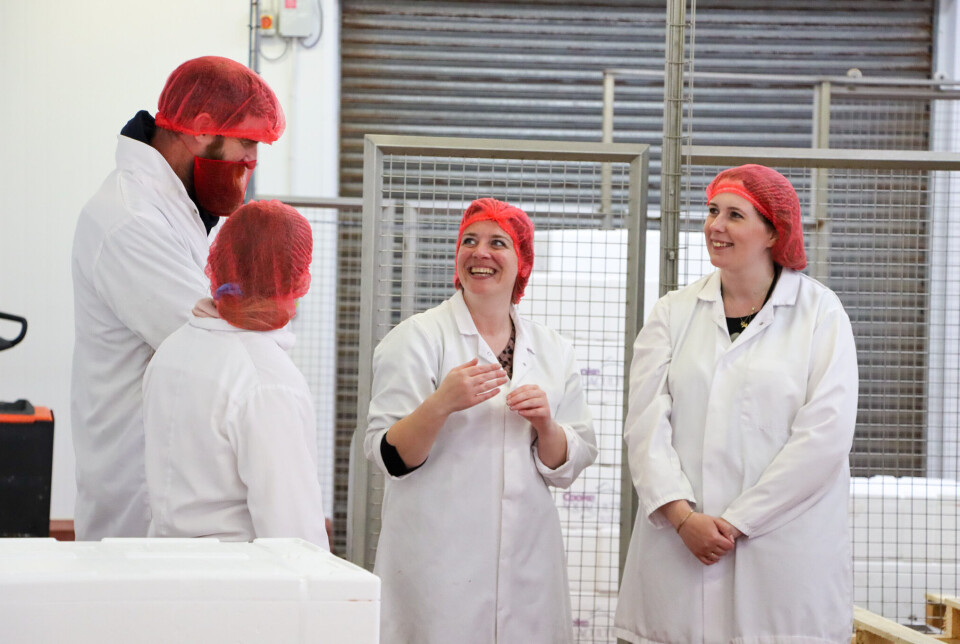 David Brown and Emma Roddick talking to processing staff at Cooke's Yell facility.