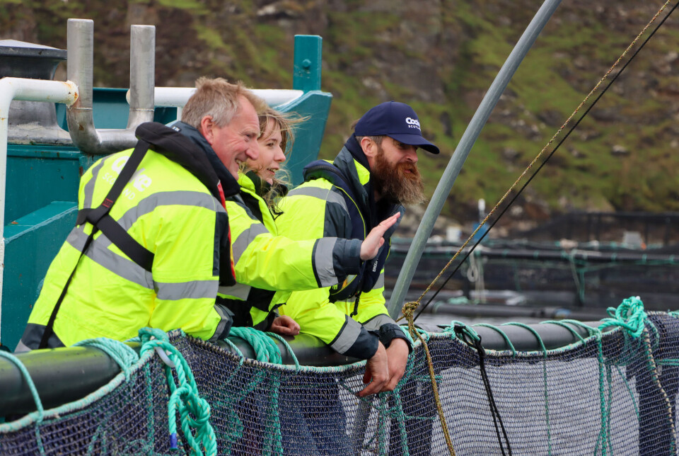 From left: Tavish Scott, Emma Roddick, and David Brown at the cage edge.
