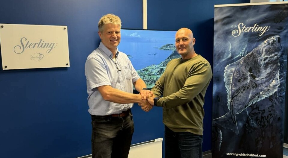Thor Bull Skarvatun, technical manager in Sterling White Halibut, and Frode Rygh, right, sales manager in Smir Group, seal the deal for a waterborne feeding system for halibut.